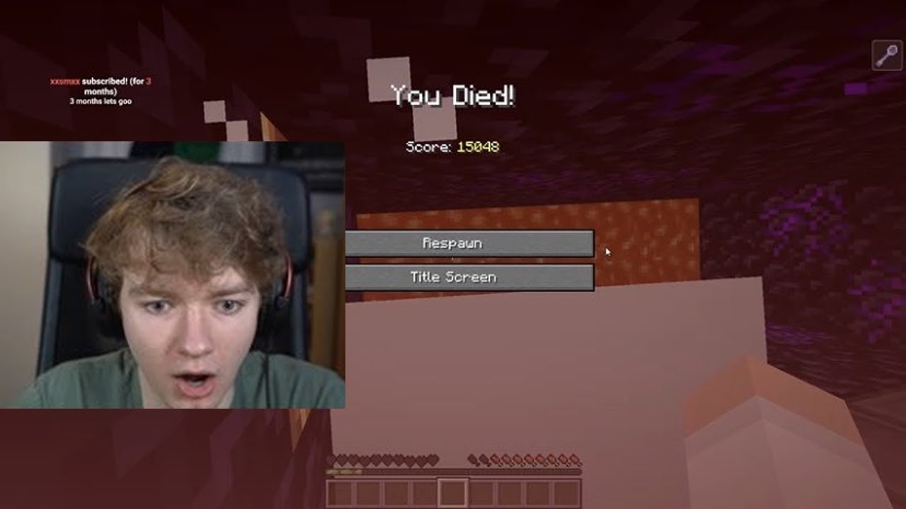 A screenshot from Tommy's stream. He's standing in the prison cell, white particles taking up most of his screen. The Minecraft death message, You Died! is at the top of the screen. Tommy's webcam shows him schocked.
